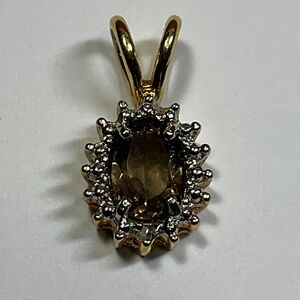 Sterling Silver gold tone DBJ Smokey Quartz pendant. 3/4 inches long